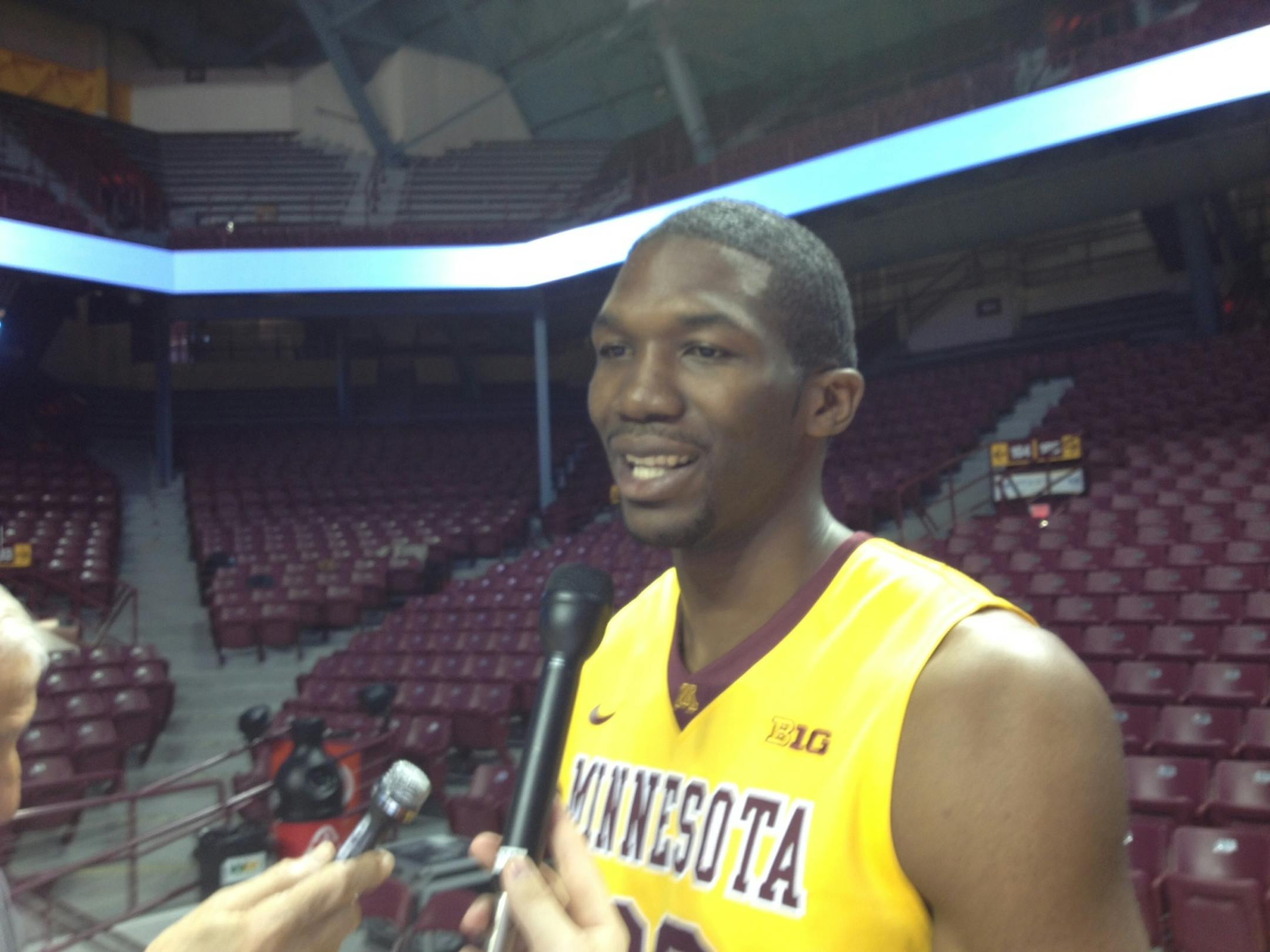 Trevor Mbakwe talks at Gophers media day.