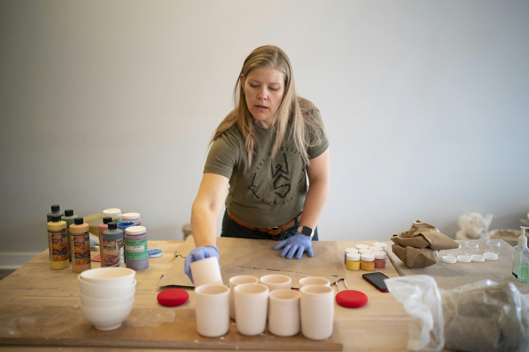 Business owner Jennie Tang assembled "pottery to go" kits at The Workshop Mpls. in the Keewaydin neighborhood.