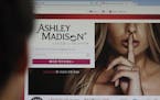 FILE - A June 10, 2015 photo from files showing Ashley Madison's Korean web site on a computer screen in Seoul, South Korea.