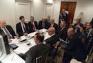In a photo provided by the White House, Donald Trump and administration figures are briefed on the strike on an air base in Syria at his Mar-a-Lago es