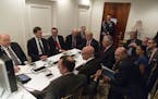 In a photo provided by the White House, Donald Trump and administration figures are briefed on the strike on an air base in Syria at his Mar-a-Lago es