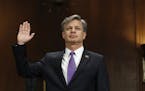 FBI Director nominee Christopher Wray is sworn-in on Capitol Hill in Washington, Wednesday, July 12, 2017, prior to testifying at his confirmation hea