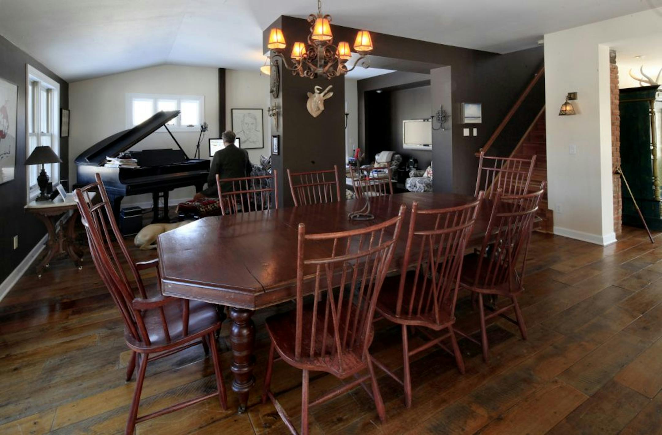 Musician Chan Poling works in the living room next to the grand piano in his home in Prior Lake, MN on February 11, 2013.