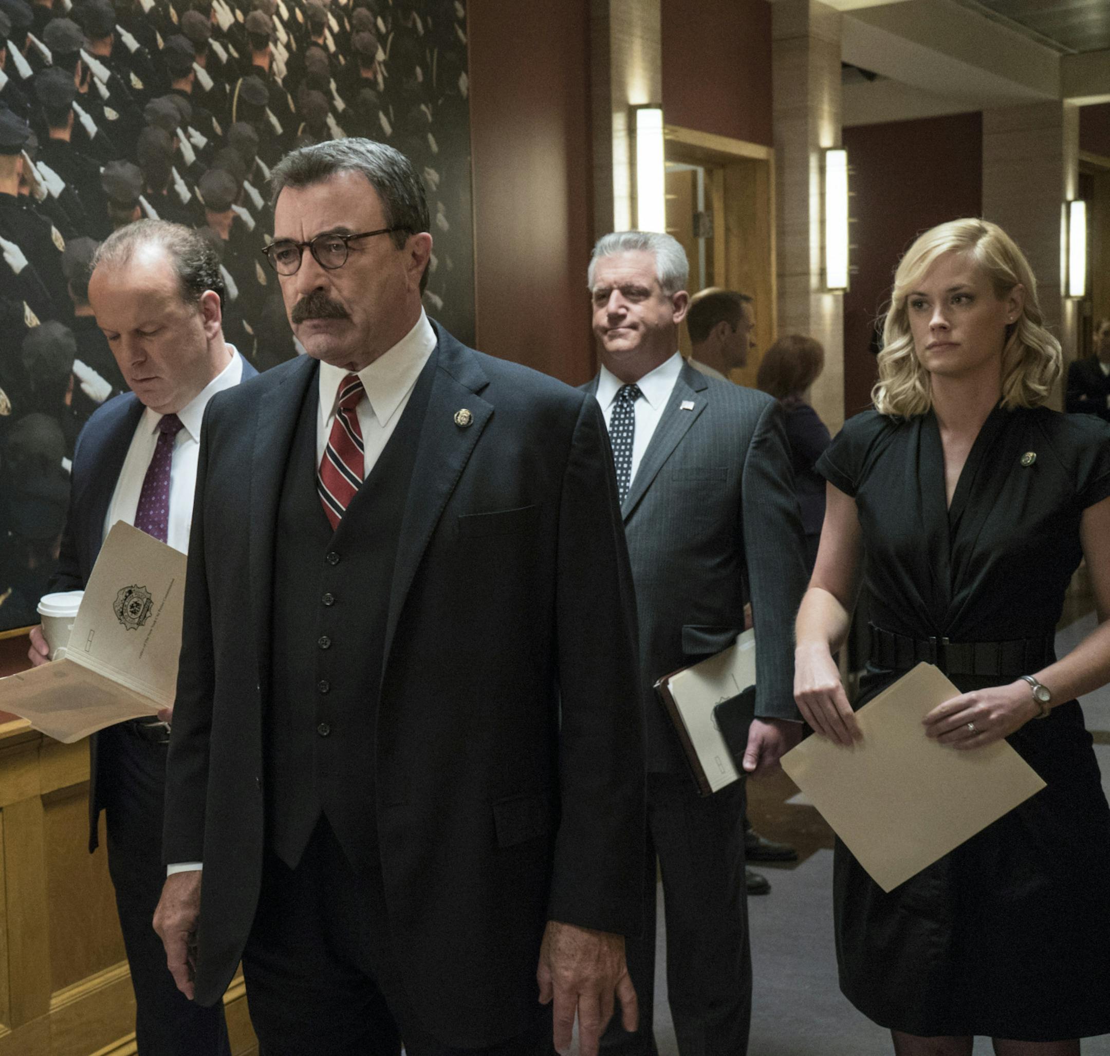 "Worst Case Scenario" -- Frank grows concerned that a threat to New York City may be imminent following a terrorist attack in the Middle East, on the sixth season premiere of BLUE BLOODS, Friday, Sept 25 (10:00-11:00 PM, ET/PT) on the CBS Television Network. Pictured: L-R: Robert Clohessy as Lt. Gormley, Tom Selleck as Frank Reagan, Gregory Jbara as DCPI Garrett Moore, Abigail Hawk as Abigail Baker. Photo: John Paul Filo/CBS √?¬©2015CBS Broadcasting Inc. All Rights Reserved.