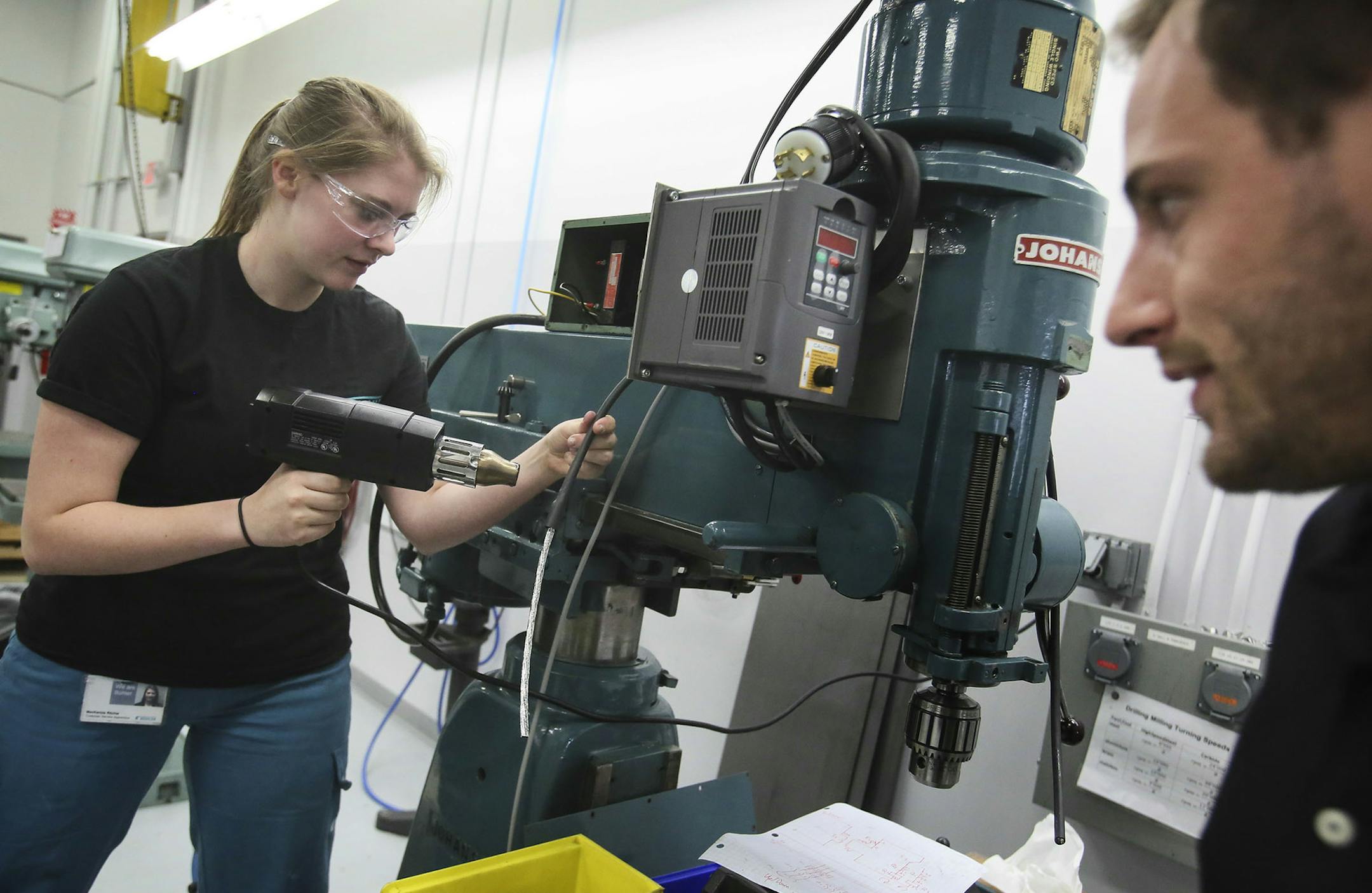 Buhler Inc, a Swiss based global market leader in the supply of flour production plants, pasta and chocolate production lines, offers a three-year apprentice program to replace retiring workers with new, highly trained workers. Here, apprentice MacKenzie Ritchie, 18, left, a Hastings High grad, works on rewiring a drill press under the guidance of Swiss instructor Dominique Hoflacher, right, at Buhler Thursday, Sept. 25, 2014, in Plymouth, MN.](DAVID JOLES/STARTRIBUNE)djoles@startribune.com Toro