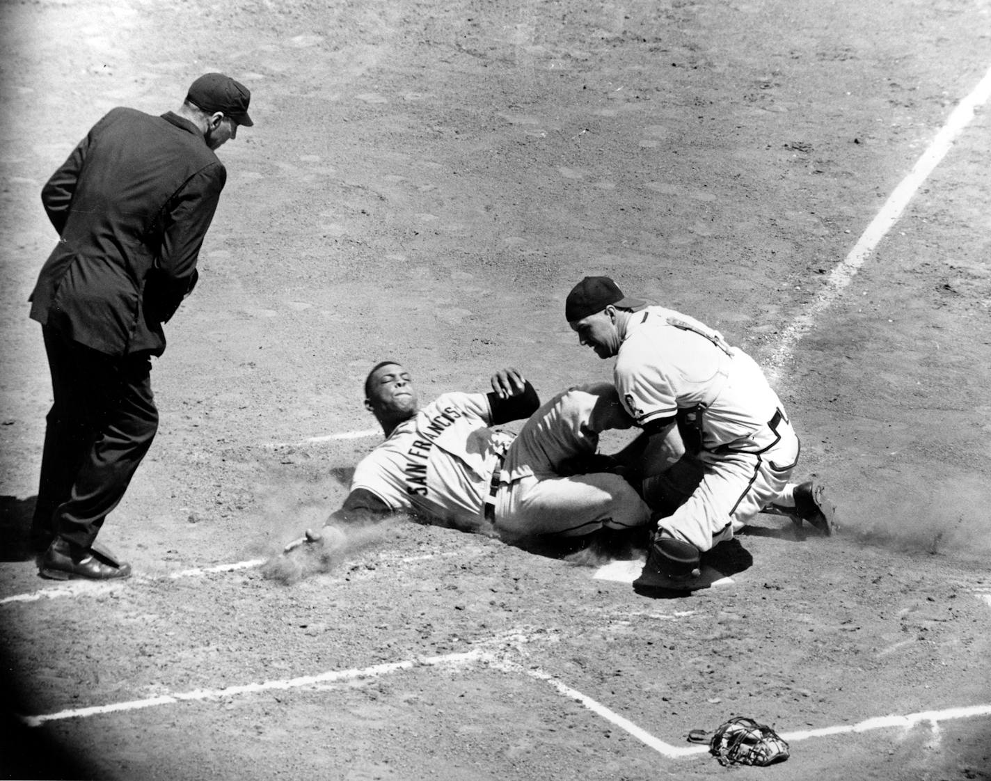 San Francisco star Willie Mays was out at home under the tag of Milwaukee catcher Del Crandall at County Stadium on June 4, 1959. Mays was trying to score from first base on Orlando Cepeda's single.