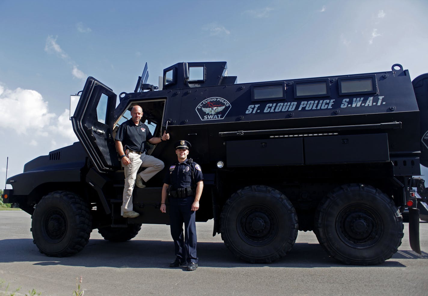 Sgt. Martin Sayre and Lt. Jeff Oxton, of the St. Cloud police department SWAT team and their Mine Resistant Ambush Protected vehicle (MRAP), that was previously used for training in Kansas on Thursday morning in St. Cloud. ] More than 8,500 pieces of military surplus equipment has been donated to Minnesota law enforcement, by the Department of Defense, in the last few years. MONICA HERNDON St. Cloud, MN 08/14/14