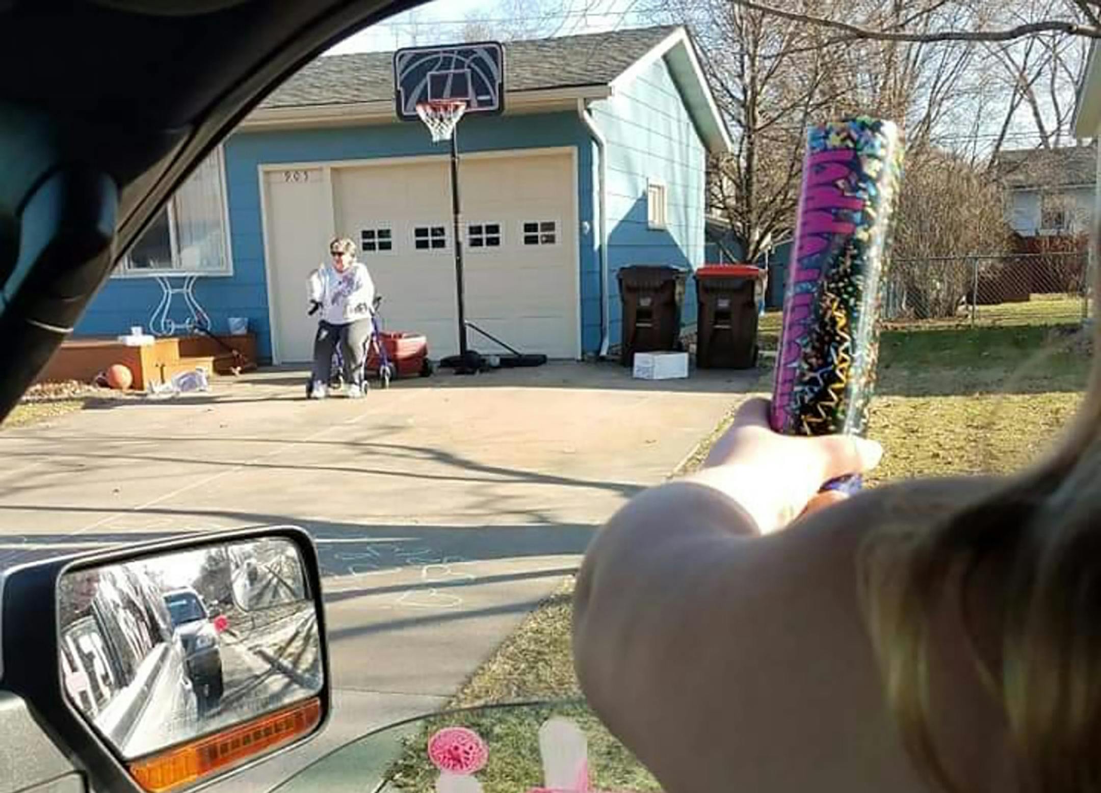 Bernie Schluessler was moved to tears as she sat in her driveway March 30, 2020, watching the parade drive by her house in celebration of her 75th birthday.