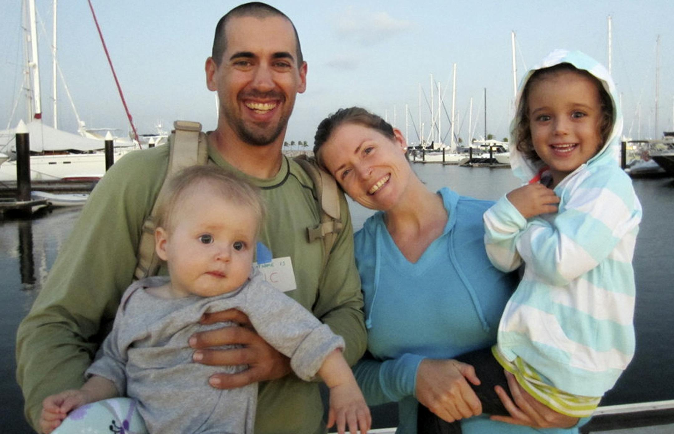 This undated image provided by Sariah English shows Eric and Charlotte Kaufman with their daughters, Lyra, 1, and Cora, 3.