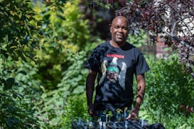 Artist Lamar Peterson is also a voracious gardener. Here he is pictured in the backyard of his south Minneapolis home.