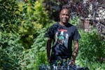 Artist Lamar Peterson is also a voracious gardener. Here he is pictured in the backyard of his south Minneapolis home.