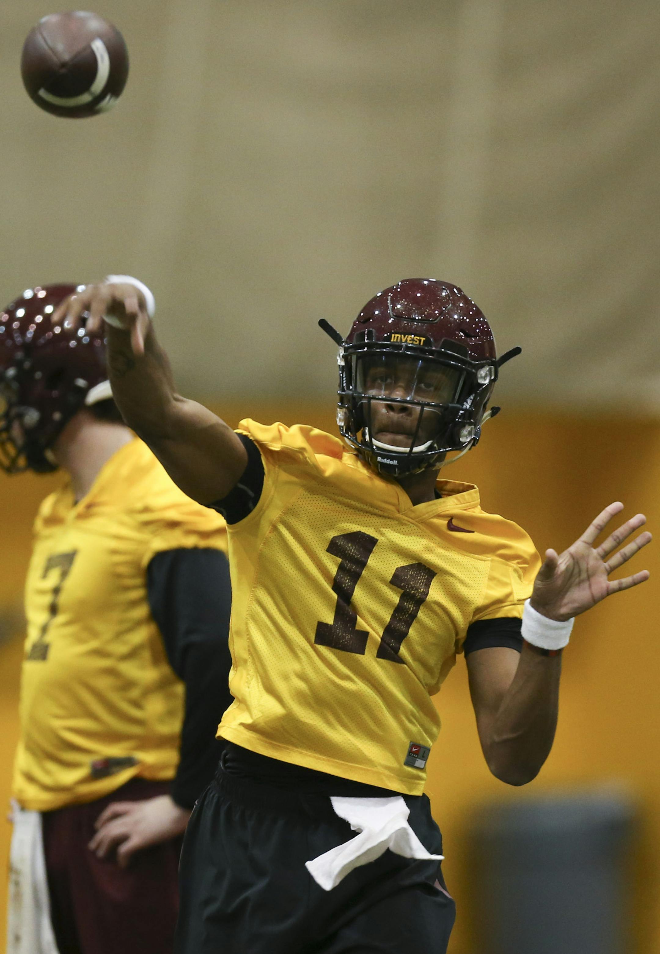 Head coach Tracy Claeys, left, and his new offensive coordinator Jay Johnson, right both watched sophomore quarterback Demry Croft throw during a drill Tuesday afternoon. ] JEFF WHEELER &#xef; jeff.wheeler@startribune.com The University of Minnesota held their first spring football practice Tuesday afternoon, March 1, 2016 at the Gibson-Nagurski Football Complex. ORG XMIT: MIN1603011716083067