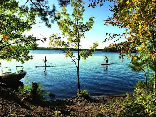 During the first day at the lodge, Brothers Nathan (left) and Gabe Usem broke out the paddle boards on White Iron Lake. Their family was visiting from California. Photo by Jenna Ross * jenna.ross@startribune.com