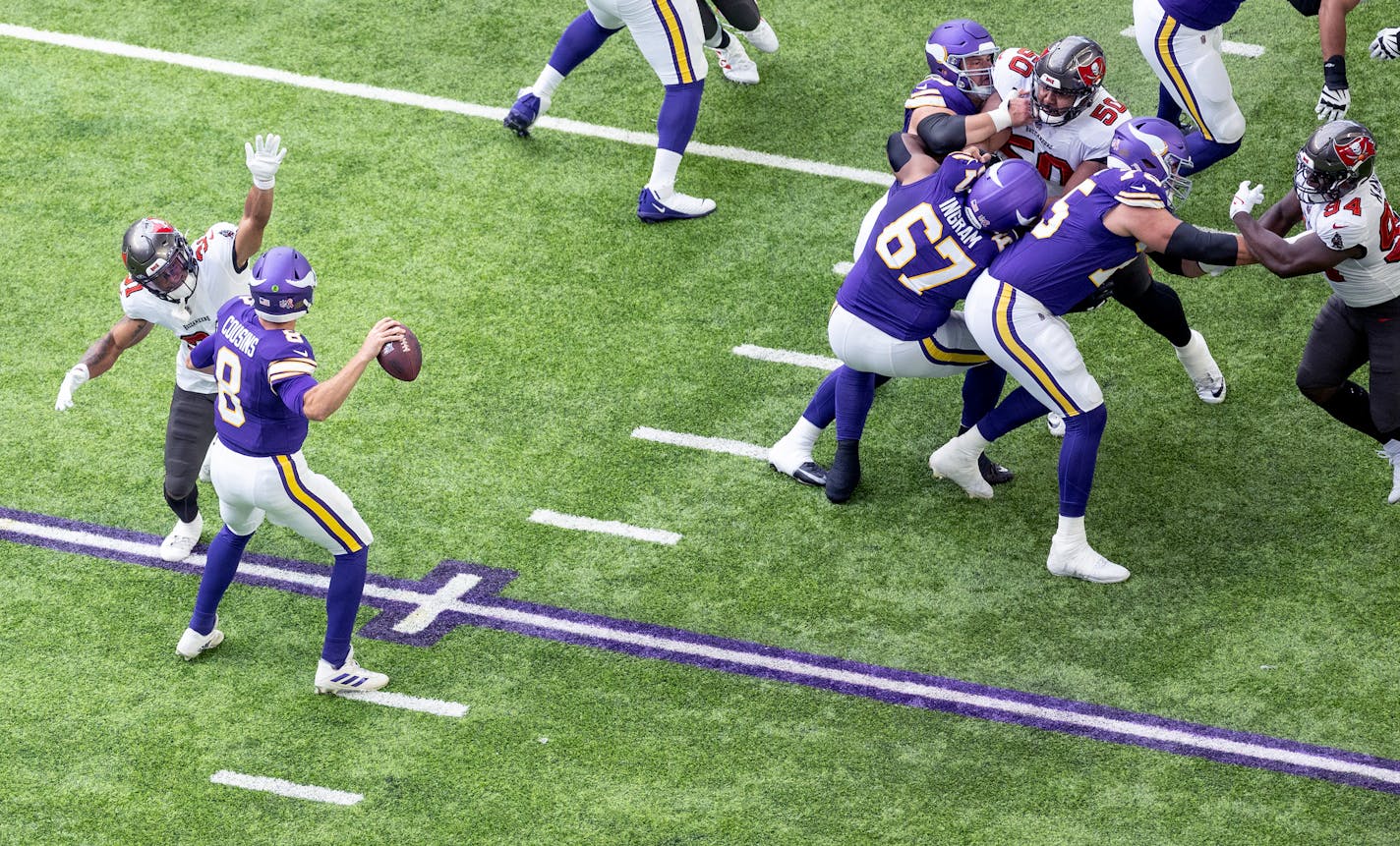 Minnesota Vikings quarterback Kirk Cousins (8) is pressured by Antoine Winfield Jr. (31) of the Tampa Bay Buccaneers quarter Sunday, September 10, 2023, U.S. Bank Stadium in Minneapolis, Minn. ] CARLOS GONZALEZ • carlos.gonzalez@startribune.com