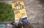 Steven Hudson protests, Tuesday, May 26, 2020, in Minneapolis, near the site where a black man, who was taken into police custody the day before, late