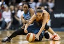 Minnesota Lynx guard Jia Perkins (7) and Phoenix Mercury guard Diana Taurasi (3) collided while chasing down a loose ball in the closing seconds of th