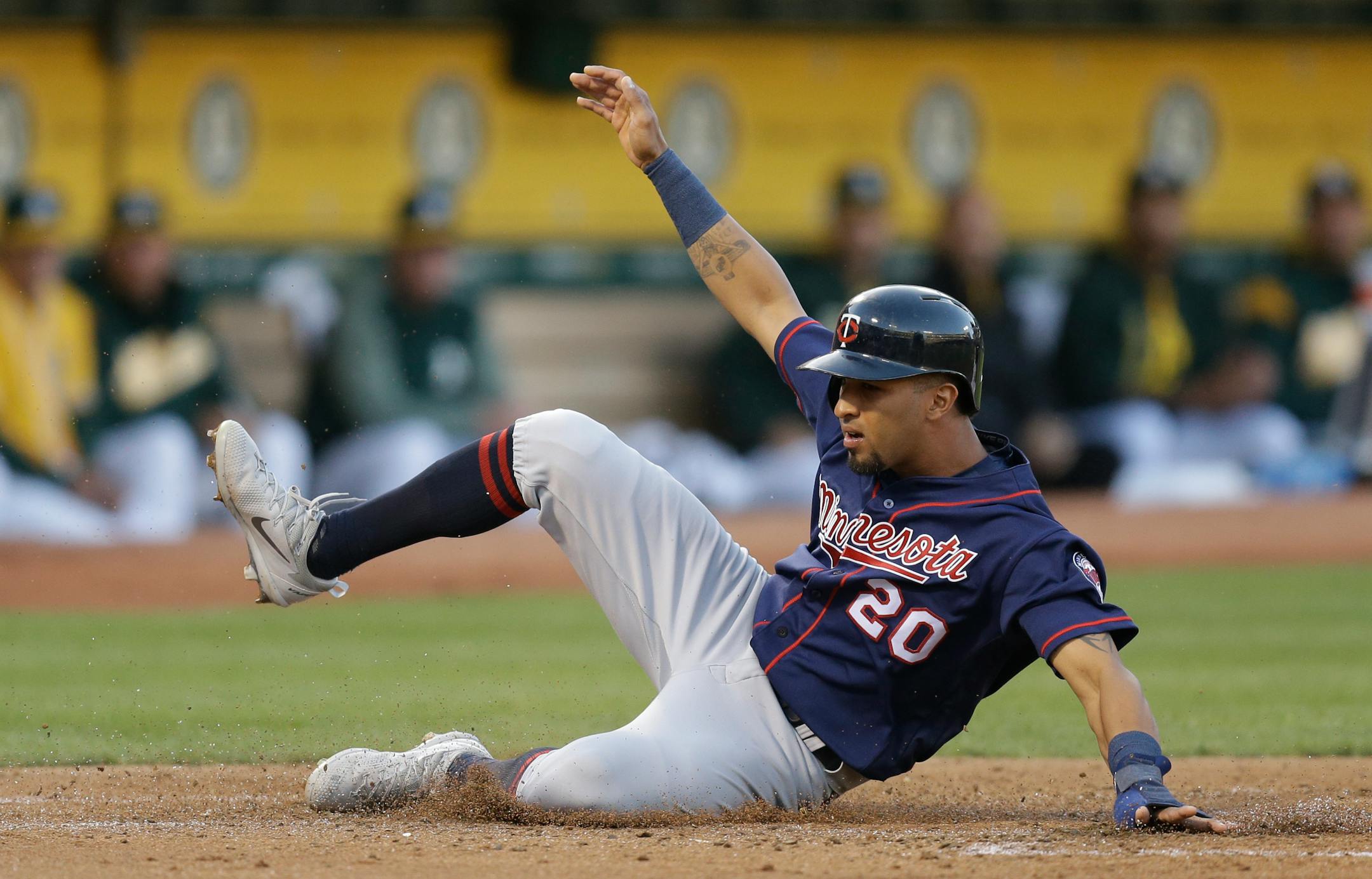 Minnesota Twins' Eddie Rosario slides after being tagged out at home plate during the second inning of the team's baseball game against the Oakland Athletics on Friday, July 28, 2017, in Oakland, Calif. (AP Photo/Ben Margot)