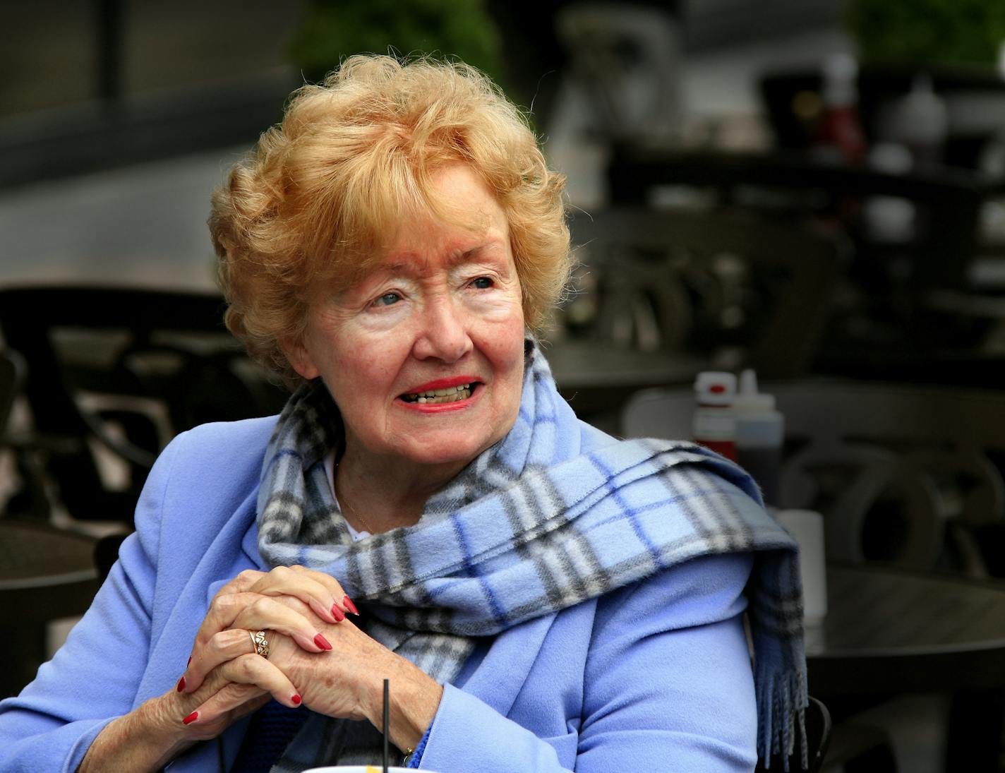 Barbara Flanagan, a former Star Tribune columnist, sits at Brit's sidewalk cafe after receiving congratulations from Minneapolis Mayor R.T. Rybak after he proclaimed "Barbara Flanagan Day." The longtime Star Tribune writer was celebrated for championing sidewalk cafes.