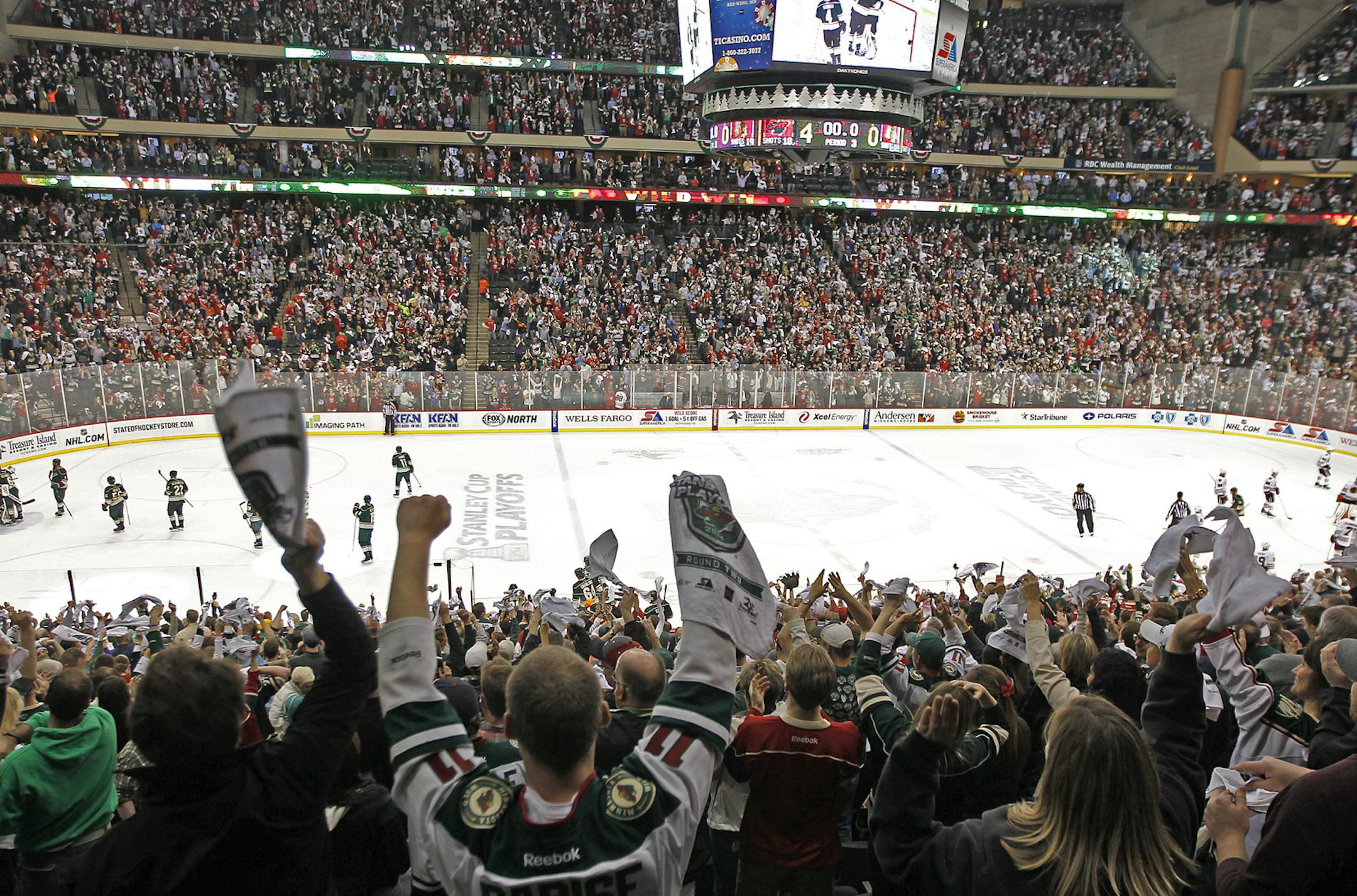 Minnesota fans celebrated a Wild goal in the third period as the Minnesota Wild took on the Chicago Blackhawks in game 3 of the series the the Stanley Cup Playoffs, Tuesday, May 6, 2014 at the Xcel Energy Center in St. Paul, MN. ] (ELIZABETH FLORES/STAR TRIBUNE) ELIZABETH FLORES • eflores@startribune.com ORG XMIT: MIN1405062316496270
