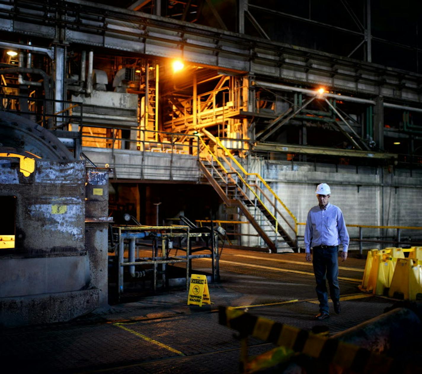 Bruce Richardson, V.P. for corporate communications walked in the crusher Building at PolyMet Mine where rock chunks containing ore will be pulverized in these mills. PolyMet Mine in Hoyt Lakes, Minn. has been mired in a permitting battle for over eight years and the issue has become politicized in the state and particularly in the eighth congressional district. ] Hoyt Lakes, MN -- Wednesday, August 20, 2014. GLEN STUBBE * gstubbe@startribune.com