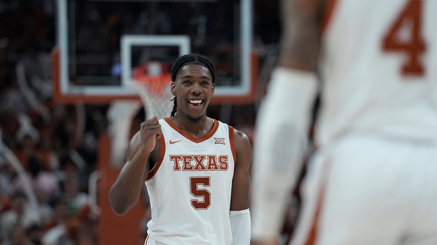 Texas guard Marcus Carr (5) celebrates a play during the second half of an NCAA college basketball game against Kansas in Austin, Texas, Saturday, March 4, 2023. (AP Photo/Eric Gay)