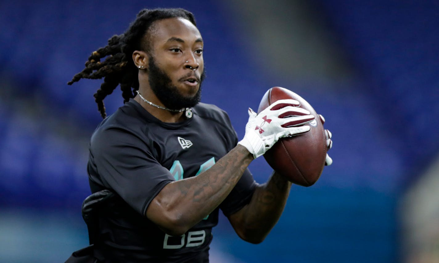 Temple defensive back Harrison Hand runs a drill at the NFL football scouting combine in Indianapolis, Sunday, March 1, 2020. (AP Photo/Michael Conroy)