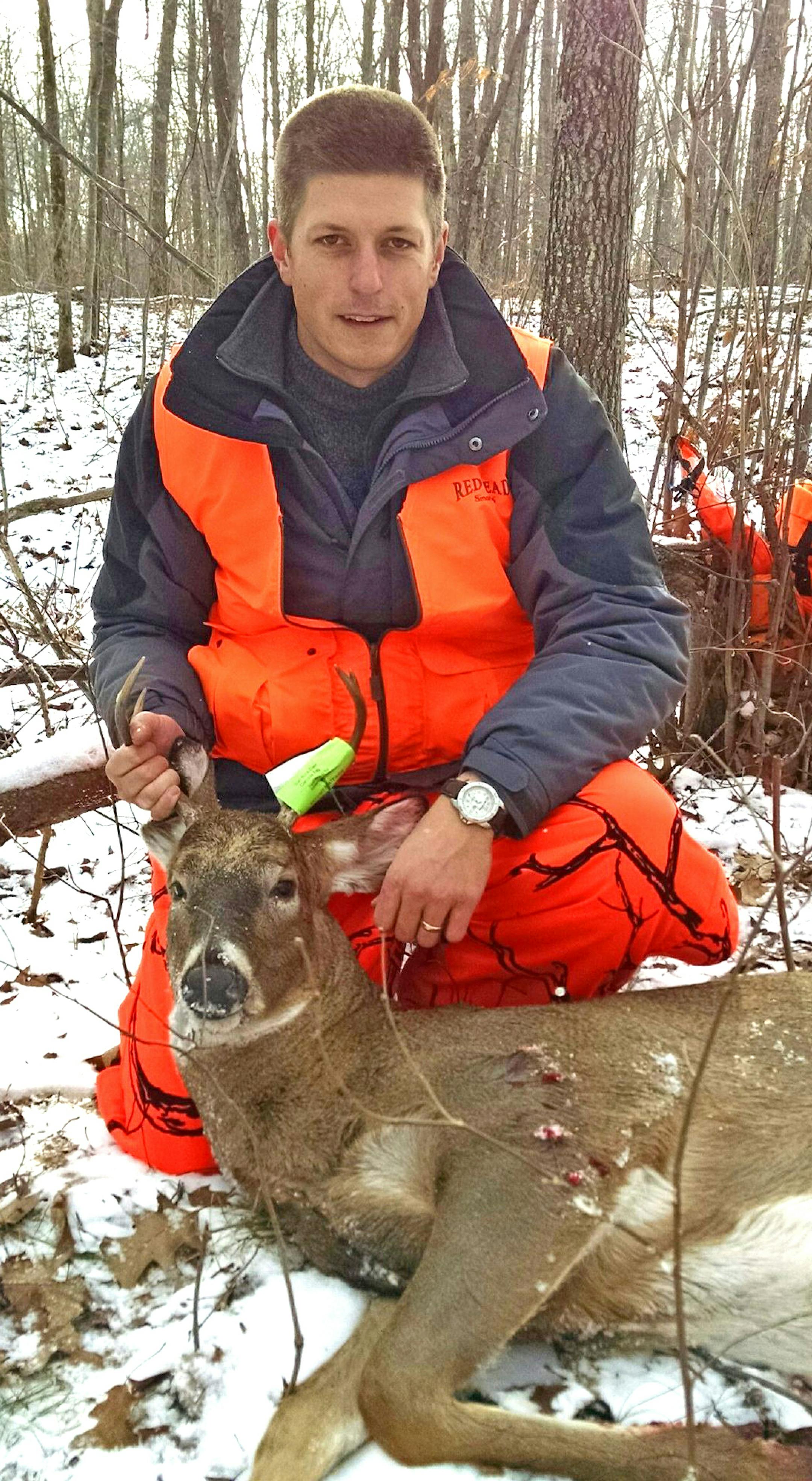 Right:  Frank Brannon of Westchester, Ill., shot his first deer Saturday, a fork buck, hunting northeast of Cumberland, on the opening day of the Wisconsin deer season.