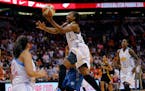 In this July 19, 2014, photo, the East's Tamika Catchings, of the Indiana Fever, scored the winning basket during overtime of the WNBA All-Star Game i