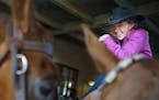 Michelle Sparks,26, aboard her quarter horse Lucky as took a break between events. She is competing with her sister Bree in the Western Saddle Club As