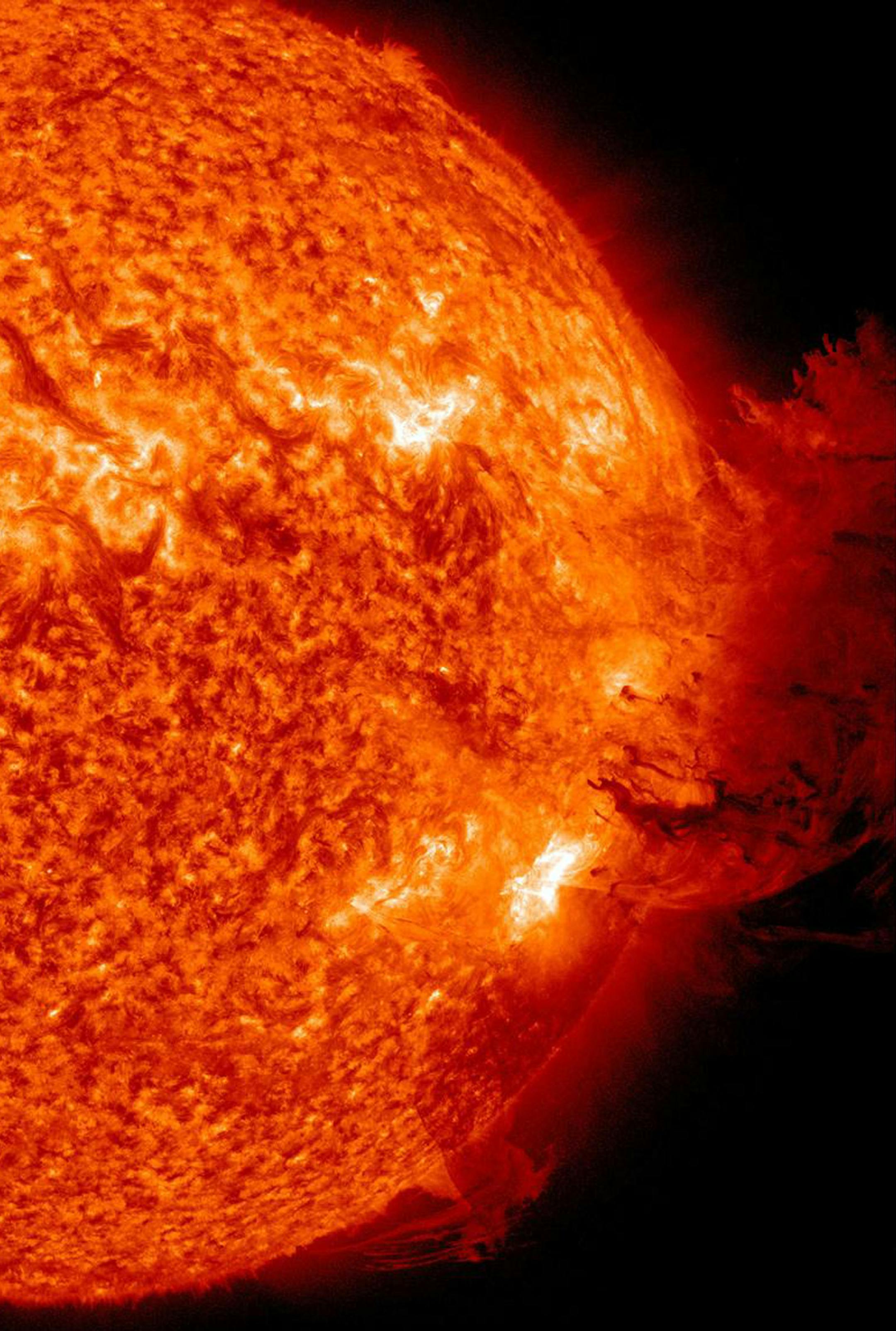 This image provided by NASA shows the Sun unleashing a medium-sized solar flare, a minor radiation storm and a spectacular coronal mass ejection on June 7, 2011. The large cloud of particles mushroomed up and fell back down looking as if it covered an area of almost half the solar surface. The ejection should deliver a glancing blow to Earth's magnetic field during the late hours of June 8th or June 9th. High-latitude sky watchers should be alert for auroras when the CME arrives. (AP Photo/NASA)