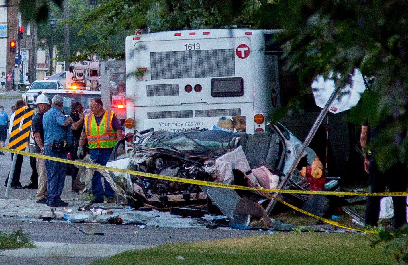 Police stand near the bus and car that collided during a fatal crash in St. Paul on July 21, 2017. ] COURTNEY PEDROZA &#x2022; courtney.pedroza@startribune.com dale st and Charles Ave, St. Paul, car bus fatal, also fire.