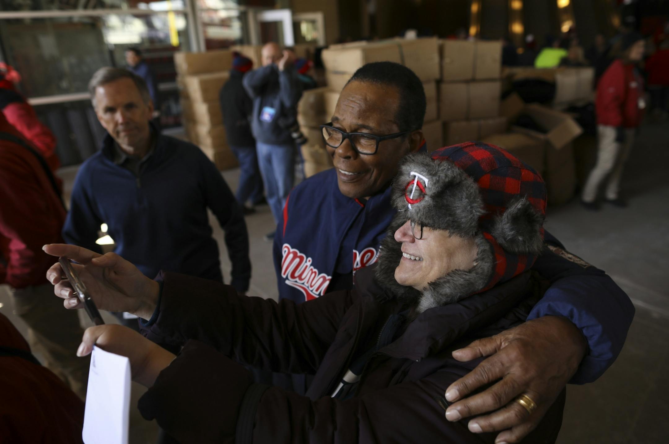 Chris Bjorge was among the first to enter through Gate 29, so named for Hall of Famer Rod Carew, who was waiting with a hug and to pose for a selfie. "OMG!," she said. "I'm like, in heaven. I got a hug!"