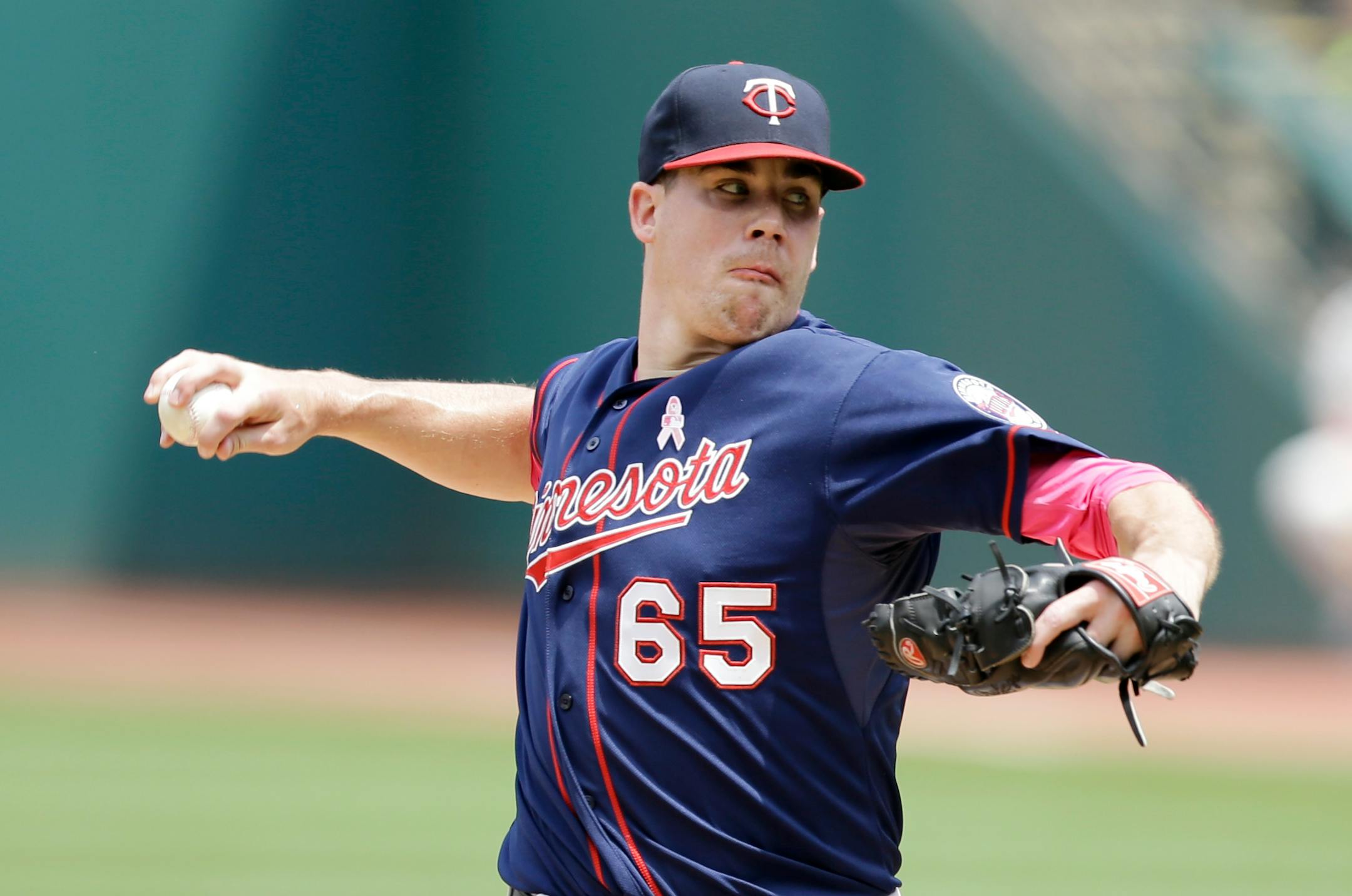 Minnesota Twins starting pitcher Trevor May delivers in the first inning of a baseball game against the Cleveland Indians, Sunday, May 10, 2015, in Cleveland. (AP Photo/Tony Dejak)