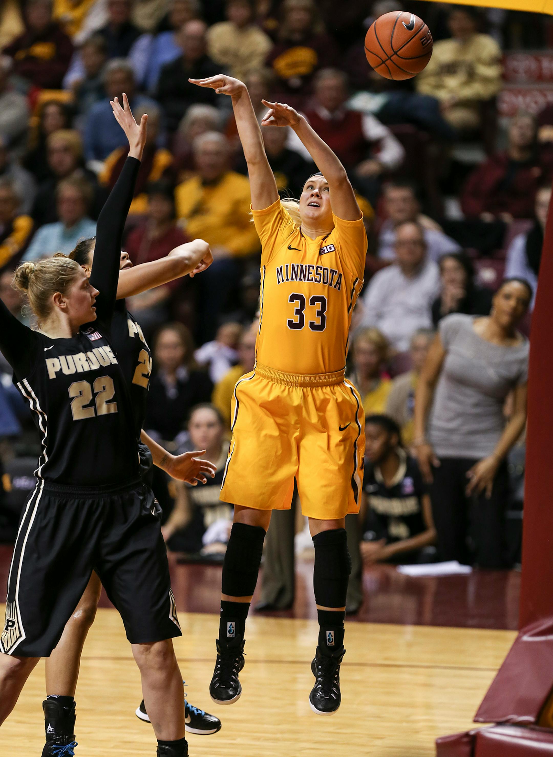 Purdue's Bree Horrocks (22) knocked the ball out of bounds from Gophers Carlie Wagers (33) hand during the first half. ] RENEE JONES SCHNEIDER • reneejones@startribune.com Minnesota Gophers women's basketball verse. Purdue Boilermakers at Williams Arena at the University of Minnesota on Thursday, January 22, 2015 in Minneapolis, Minn.