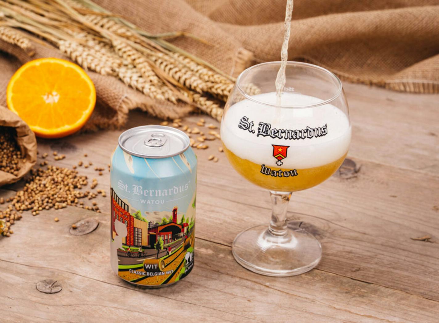 A can and glass of St. Bernardus witbier, a classic Belgian witbier from Brouwerij St. Bernardus in Watou, Belgium.