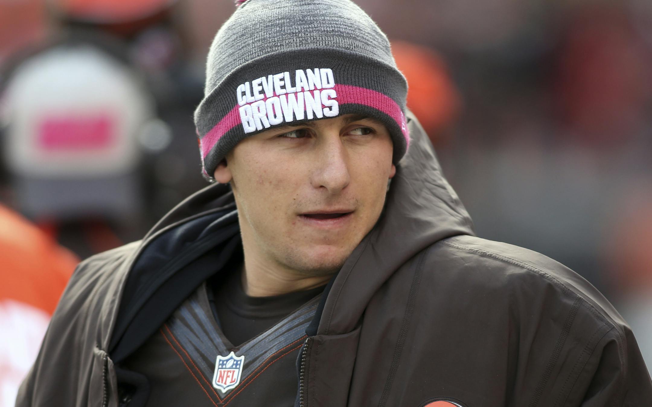 In this Sunday, Oct. 18, 2015, photo Cleveland Browns quarterback Johnny Manziel watches on the sidelines during the second half of an NFL football game against the Denver Broncos, in Cleveland. Police have released a dash-cam video and 9-1-1 emergency calls from a roadside incident involving Manziel. The former Heisman Trophy winner was questioned by Avon, Ohio, police last week after Manziel got into an argument with his girlfriend, Colleen Crowley. (AP Photo/Aaron Josefczyk)