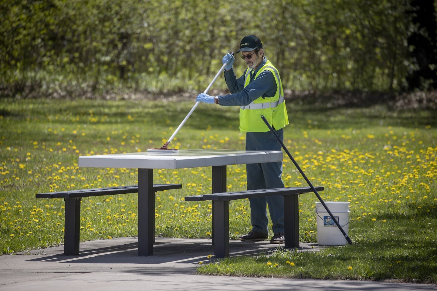 Frank Wergin of Green View, cleaned picnic tables at the New Market rest stop and truck stop, Friday, May 15, 2020 near New Market, MN.