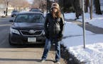 Patricia Fox stands by her vehicle, which is parked in a designated disability parking spot, in front of her Fremont Avenue home in North Minneapolis 