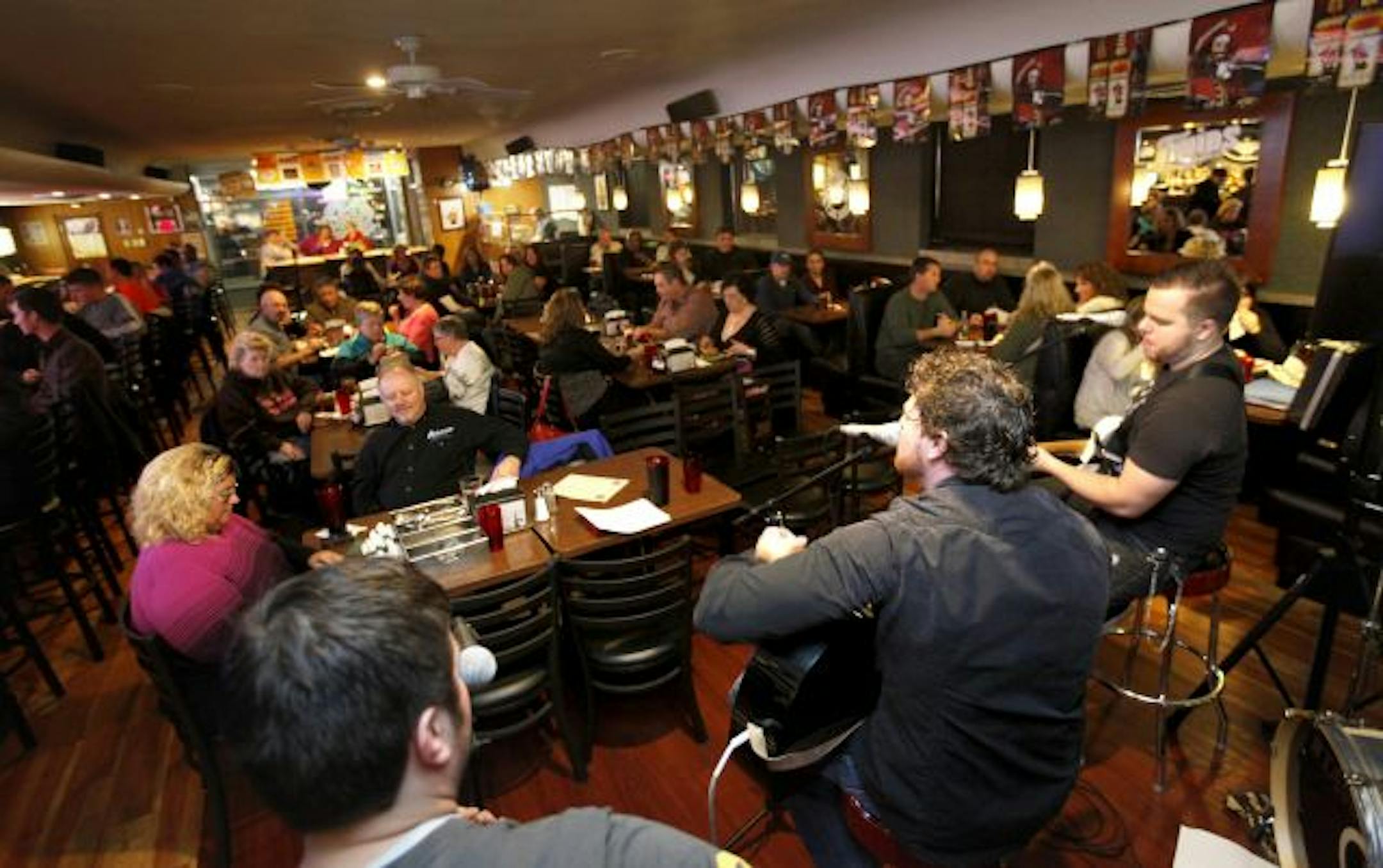 The Last Ride serenaded the Rice Street crowd on Saturday night with a medley of country-rock songs inside the Tin Cup in St. Paul.