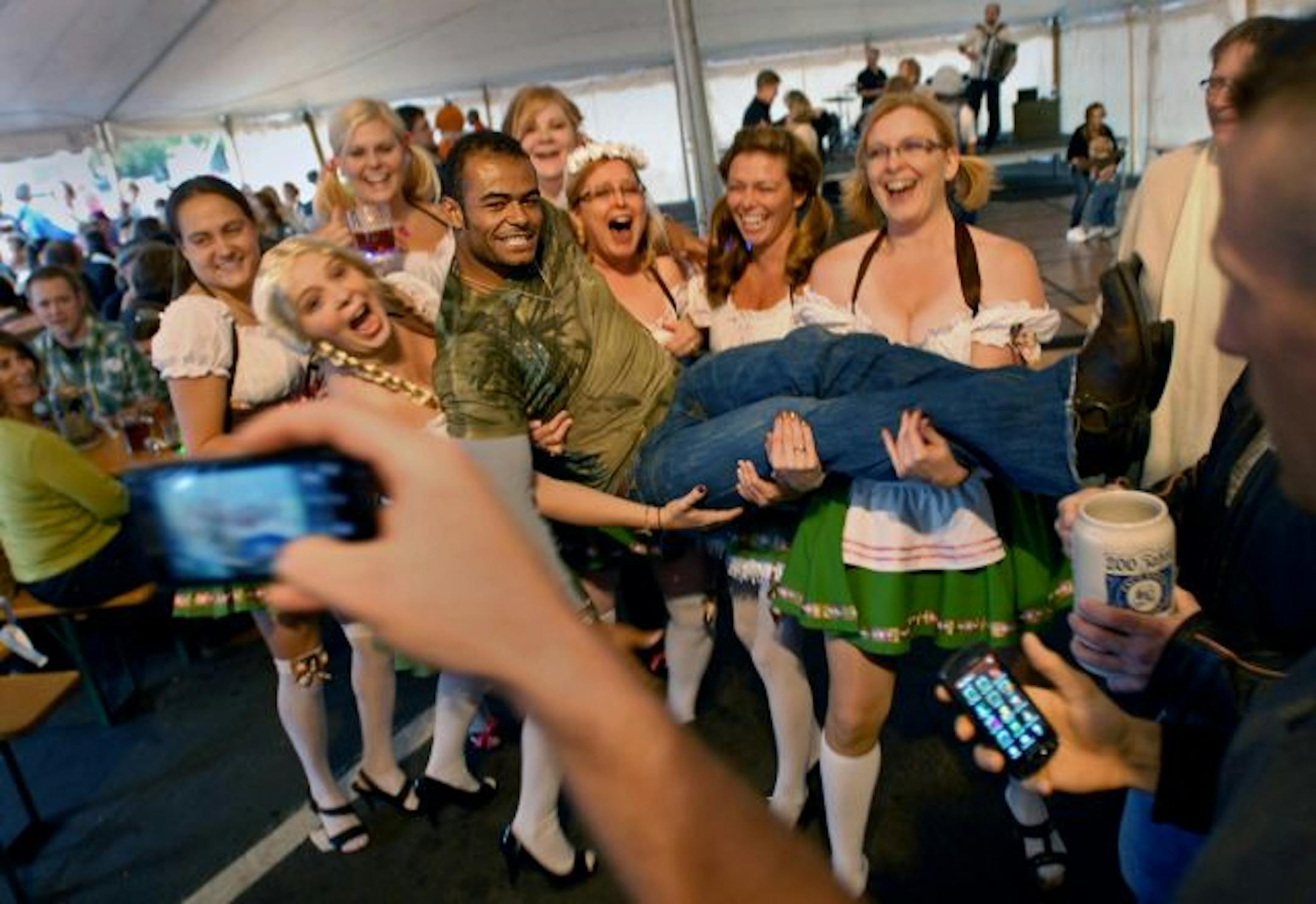 David Dutrieuille of Lakeville celebrated his first Gasthof Oktoberfest in the arms of Becky Berg's bachelorette party.