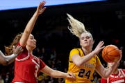 The Gophers' Mallory Heyer was defended by Wisconsin's Brooke Schramek in the second quarter Tuesday at Williams Arena.