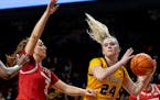 The Gophers' Mallory Heyer (24) was defended by Wisconsin's Brooke Schramek (3) in the second quarter Tuesday at Williams Arena.