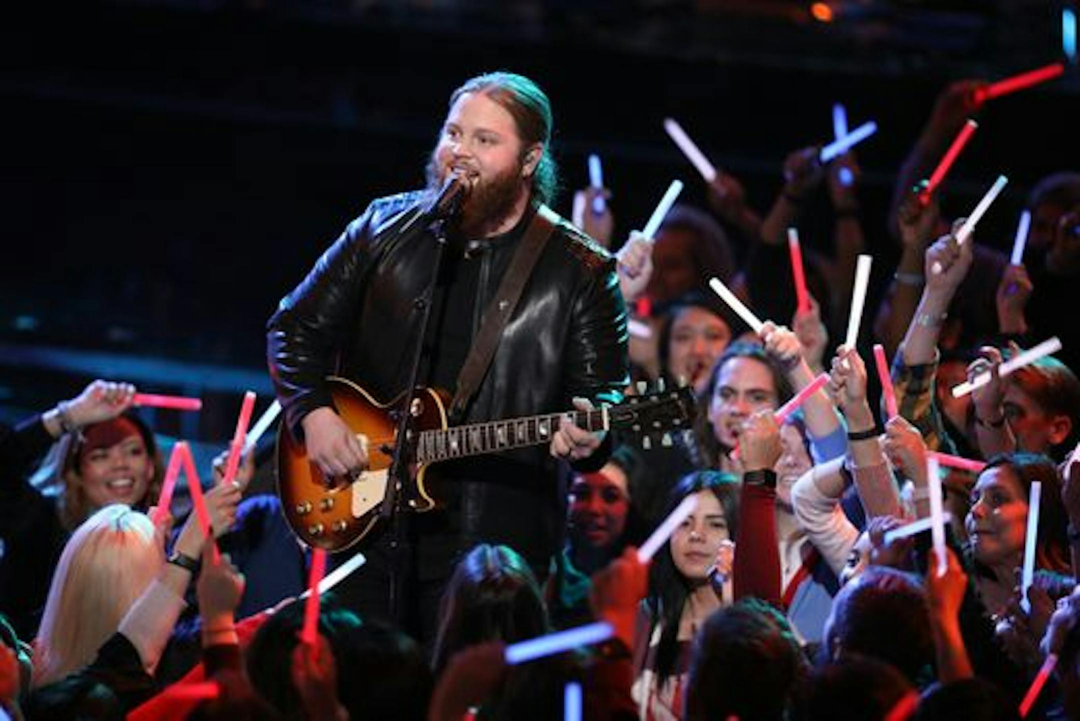 Chris Kroeze hovered over "The Voice" audience singing "Sweet Home Alabama" on Monday. / Tyler Golden, NBC