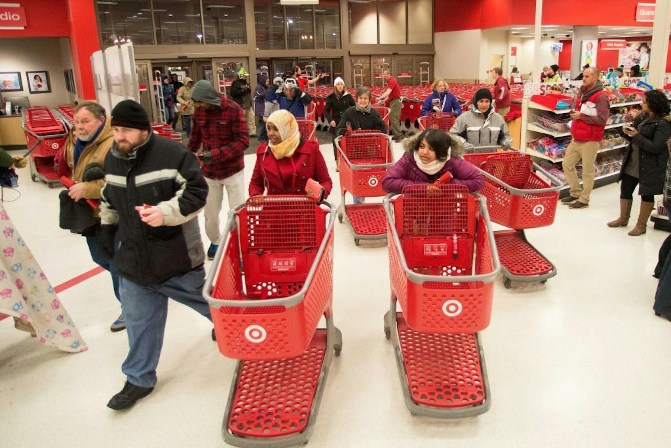 Shoppers pour into the Roseville Super Target moments after it opened on Thanksgiving night.