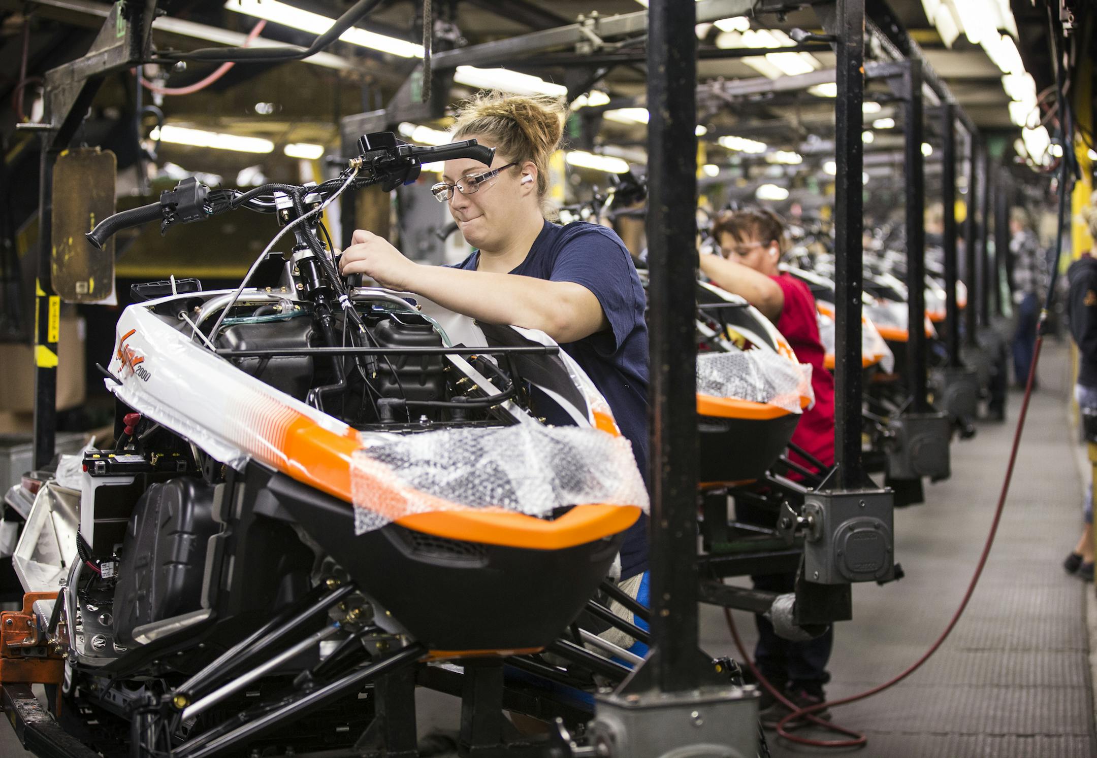 Workers assembled the 2016 Lynx 2000 snowmobile at the Thief River Falls factory.
