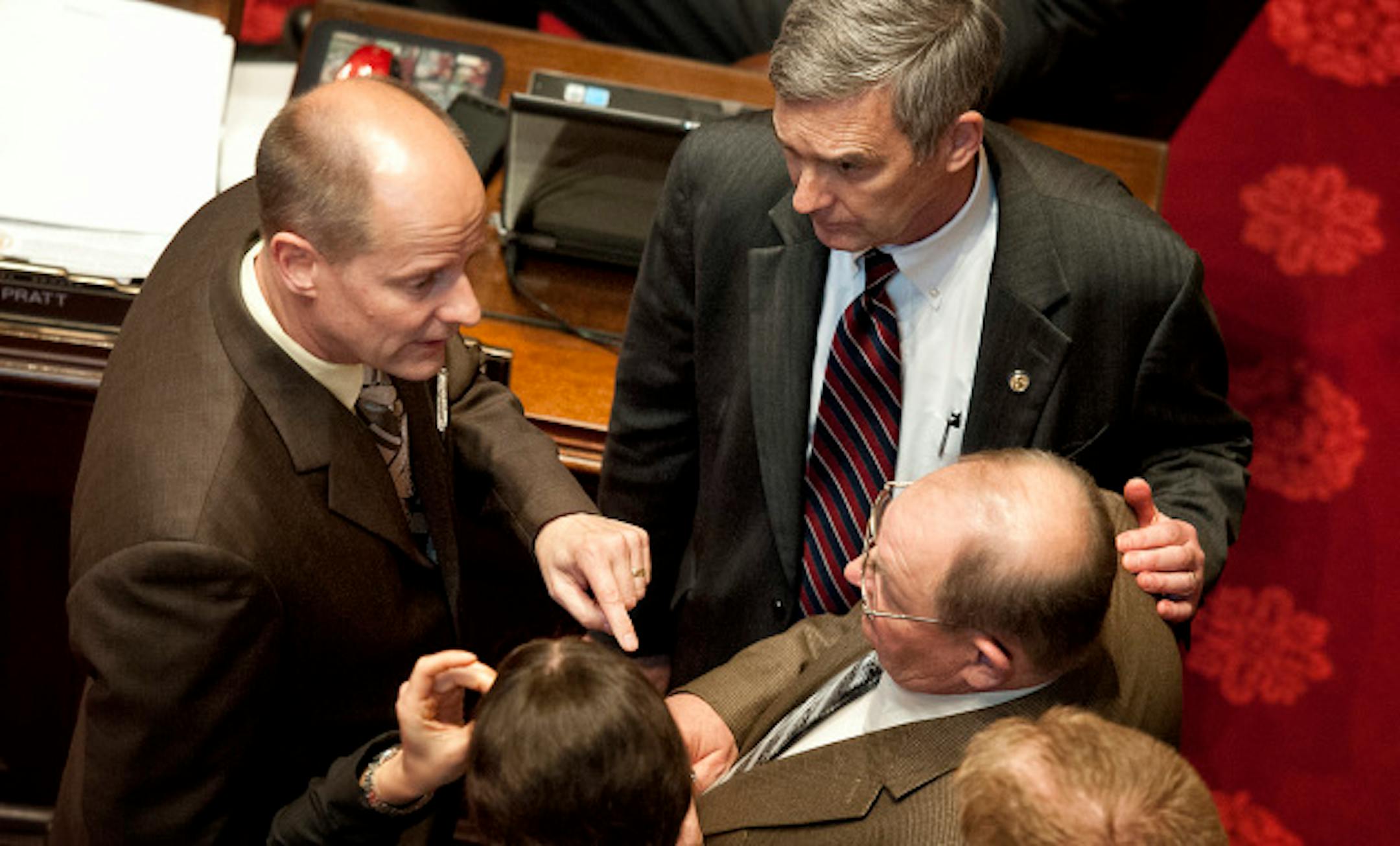 GOP Senators, from left,  Paul Gazelka, Minority Leader David Hann and Gary Dahms huddled as debate began on the minimum wage bill on the Senate floor.    Dahms led opposition to the bill.   Wednesday, May 8, 2013     ]   GLEN STUBBE * gstubbe@startribune.com