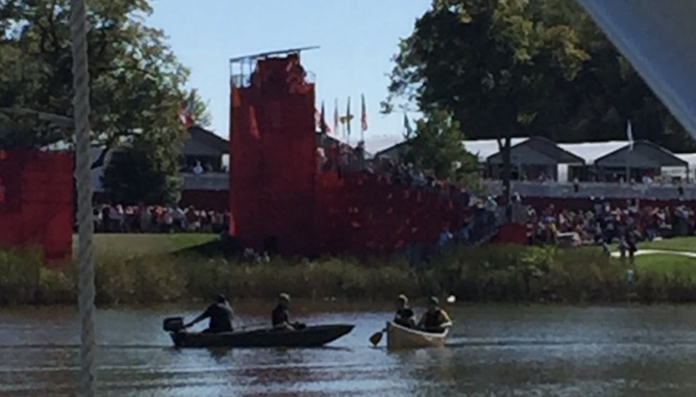 James Render was on a plane that landed on a lake next to Ryder Cup action when he took this photo of canoeists and law enforcement.