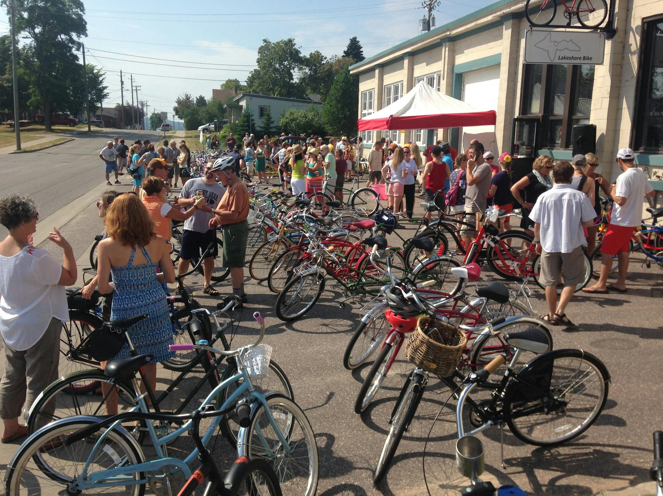 A crowd gathers to check out a collection of cruiser bikes at Lakeshore Bike Shop in Marquette, Mich. 