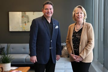 Peter Michaud and Barbara Duffy of the Ballard Spahr law firm stand for a portrait at their office in downtown Minneapolis on March 5. Michaud and Duf