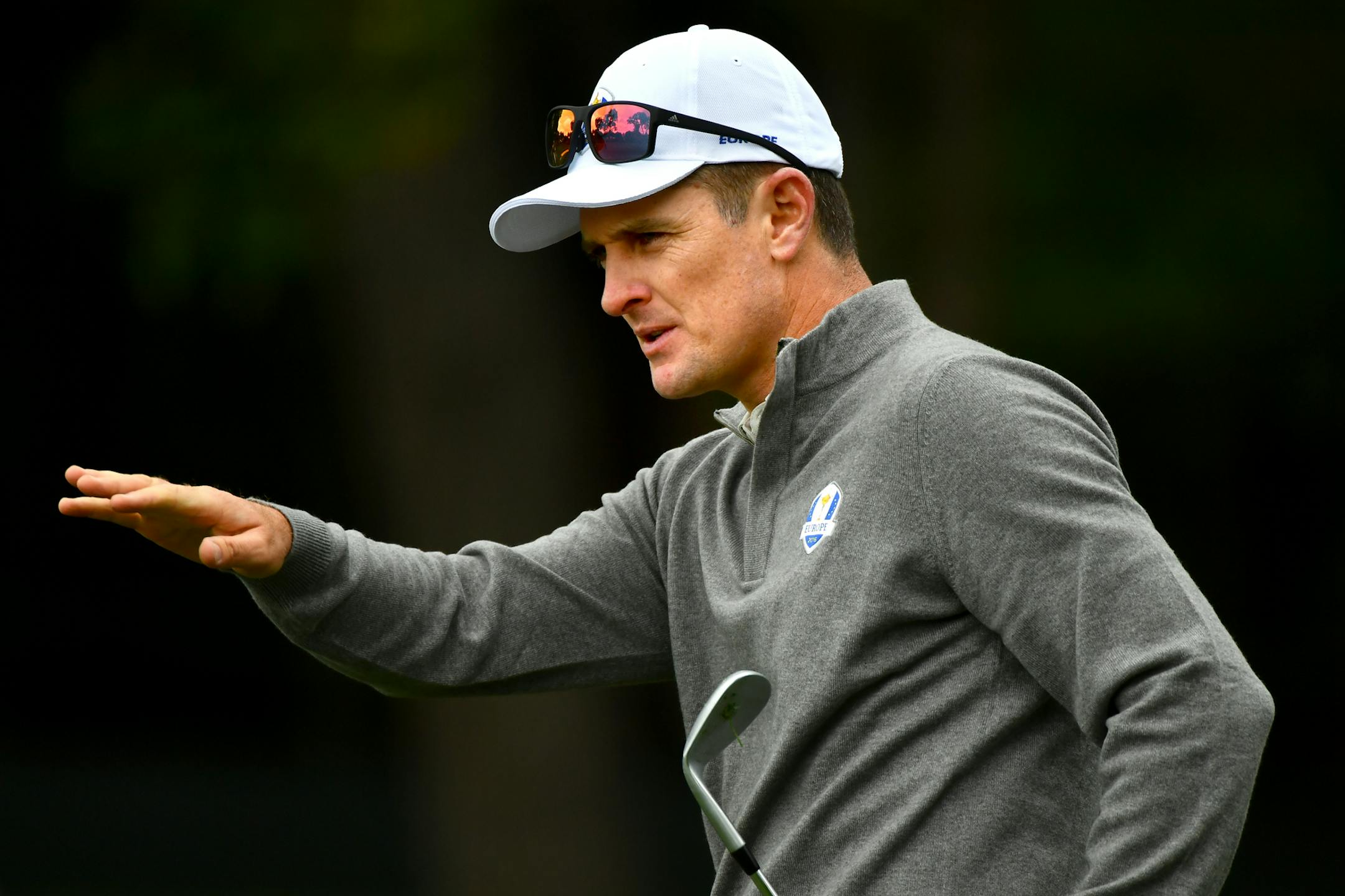Team Europe's Justin Rose gestured to teammates while practicing putting on the 13 hole during Ryder Cup practice play Wednesday.